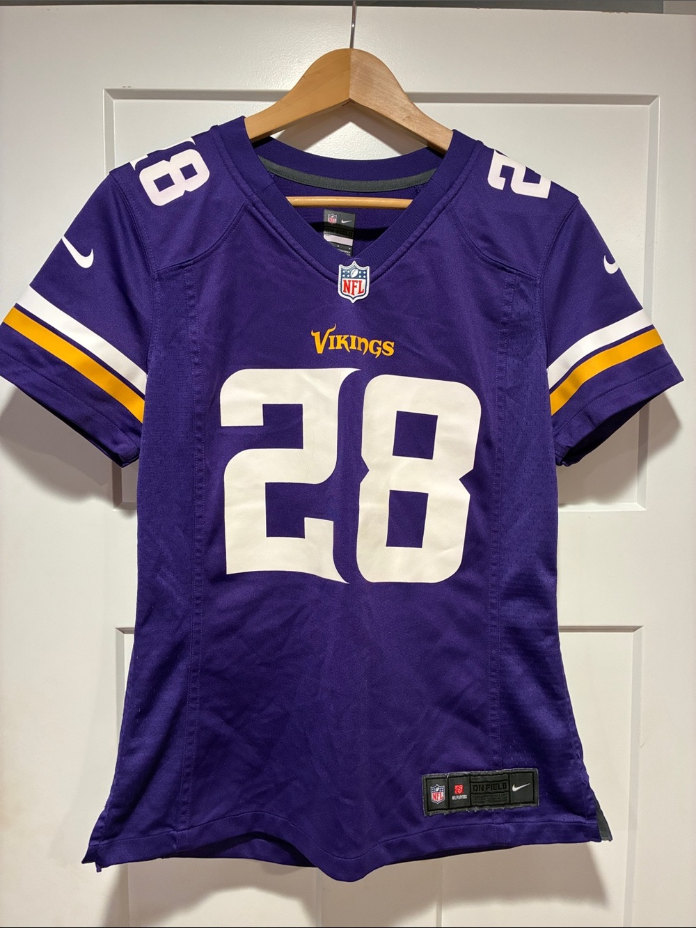 Nike Women’s Purple #28 Vikings Jersey with White & Gold Accents